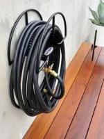 Garden Hose Holder Pakistan mounted on the outdoor garden wall