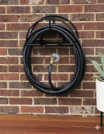 Garden Hose Holder Pakistan mounted on the outdoor garden wall
